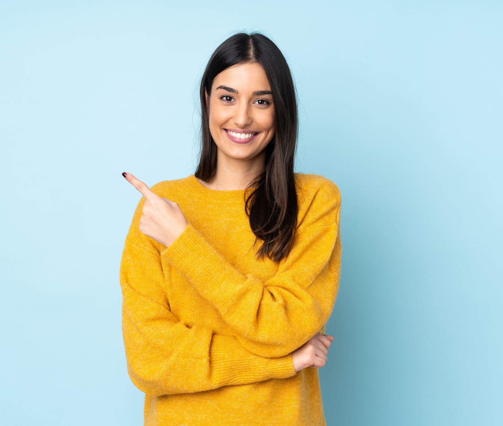 Young caucasian woman isolated on blue background pointing to the side to present a product
